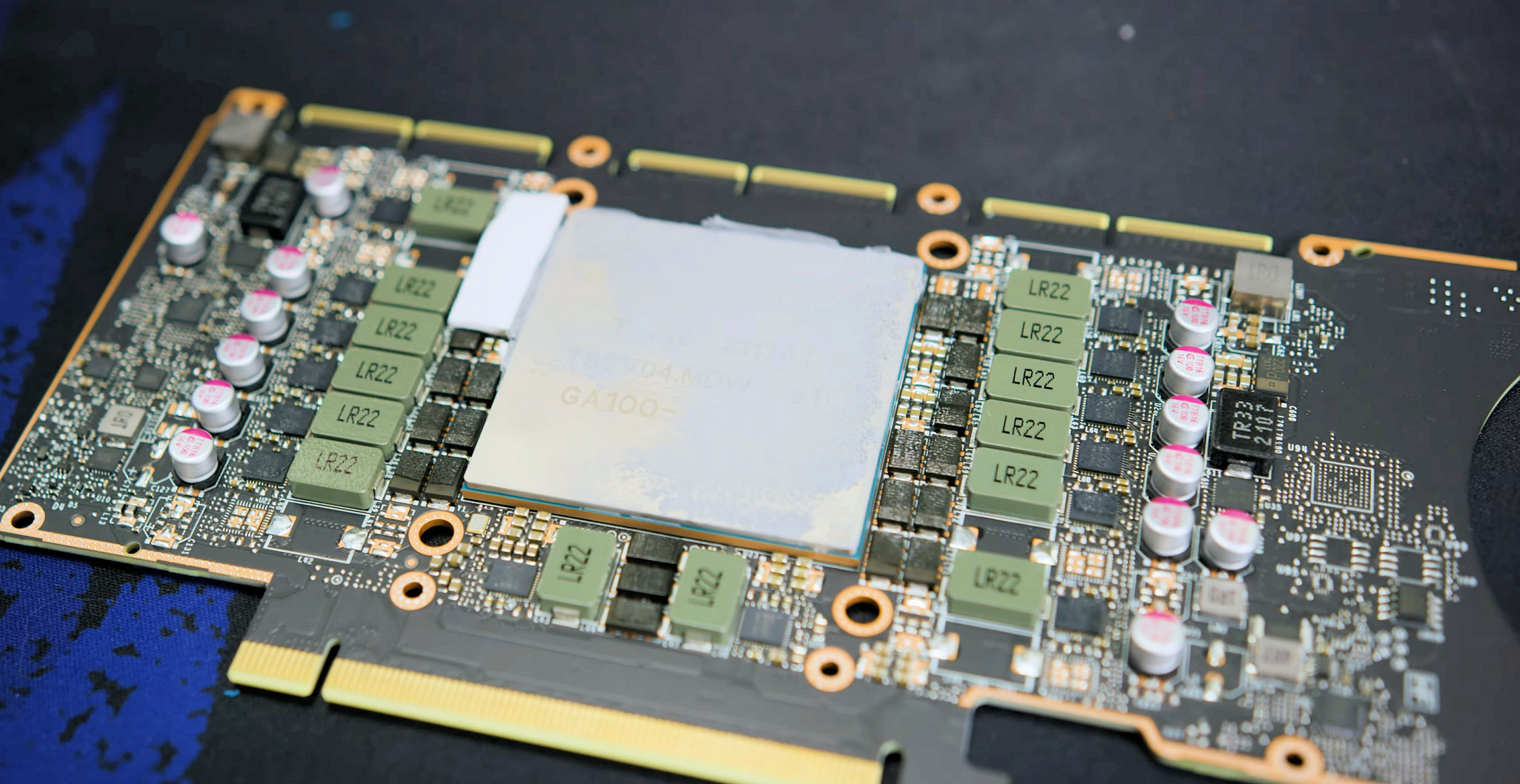 Bare CMP 170HX PCB with GA100 die visible under thermal paste